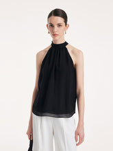 A lady wears a halter top.